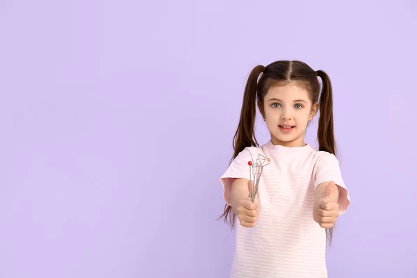 Little Girl Logopedic Tools Showing Thumb Color Background — Stock Photo, Image