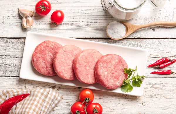 Composition Raw Cutlets Made Fresh Forcemeat Light Wooden Background — Stock Photo, Image