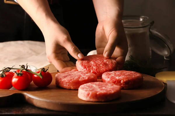 Woman Preparing Tasty Cutlets Made Fresh Forcemeat Dark Background — Stock Photo, Image