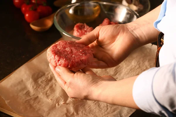 Woman Preparing Tasty Cutlets Made Fresh Forcemeat Dark Background Closeup — Stock Photo, Image