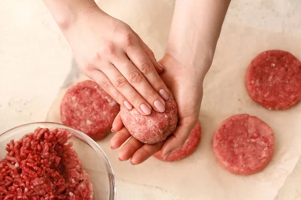 Woman Preparing Tasty Cutlets Made Fresh Forcemeat Light Background Closeup — Stock Photo, Image