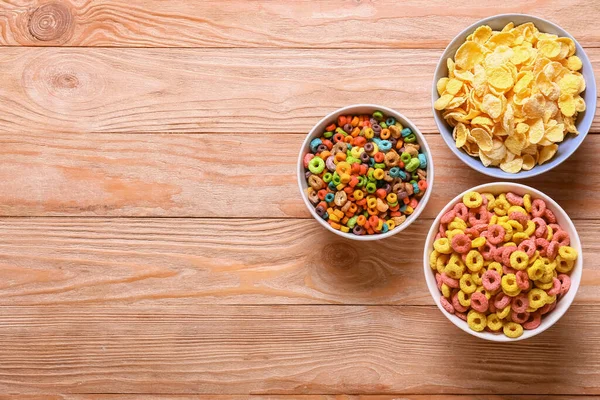 Cuencos Con Sabrosos Cereales Sobre Fondo Madera —  Fotos de Stock