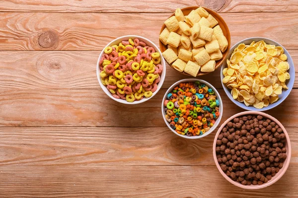 Cuencos Con Sabrosos Cereales Sobre Fondo Madera —  Fotos de Stock