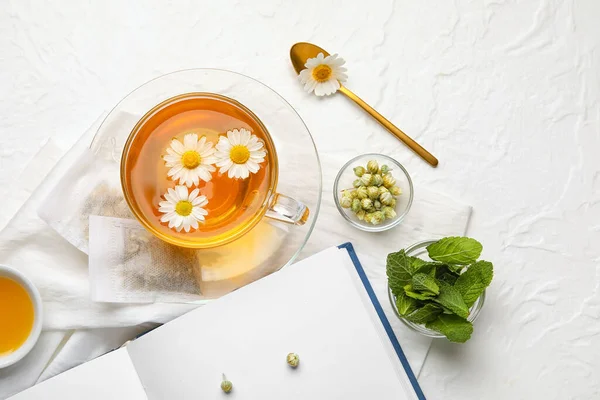 Composition Cup Chamomile Tea Book Light Background — Stock Photo, Image