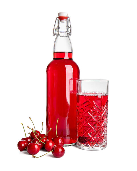 Bottle and glass of sweet cherry wine on white background