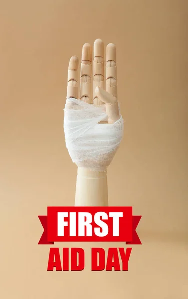 Wooden Hand Bandage Text First Aid Day Color Background — Stock Photo, Image