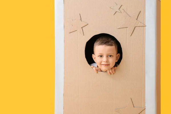 Cute Little Boy Playing Cardboard Rocket Color Background — Stock Photo, Image