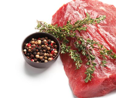 Raw beef brisket with spices on white background, closeup