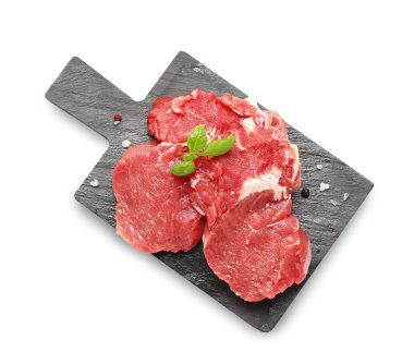 Board with raw beef meat on white background