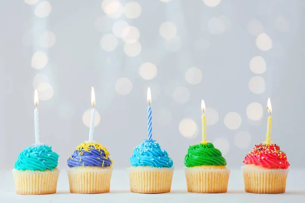 Tasty Birthday Cupcakes Burning Candles Table Defocused Lights — Stock Photo, Image