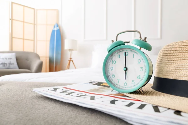 Stylish Alarm Clock Newspapers Hat Bed — Stock Photo, Image