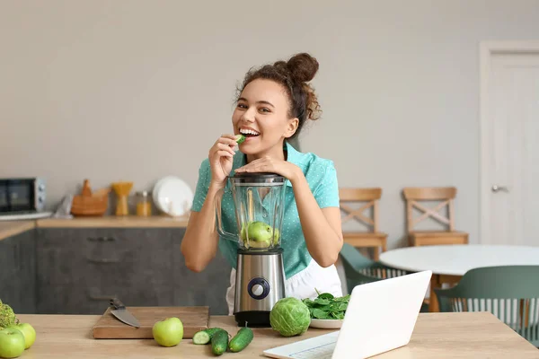 Young African American Woman Eating Cucumber Kitchen — Stock Photo, Image