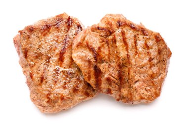 Tasty beef steaks on white background clipart