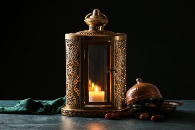 Muslim lantern with dates on dark background