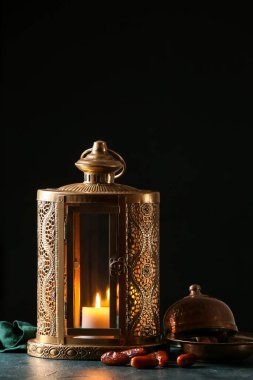 Muslim lantern with dates on dark background