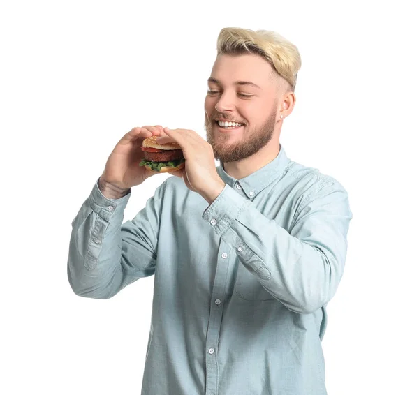 Junger Mann Isst Veganen Burger Auf Weißem Hintergrund — Stockfoto