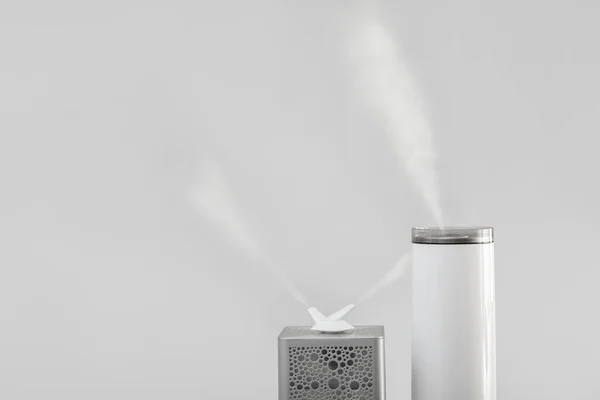 Modern Humidifiers Grey Background — Stock Photo, Image
