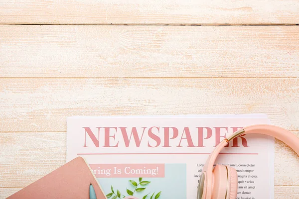 Newspaper Headphones Light Wooden Background — Stock Photo, Image