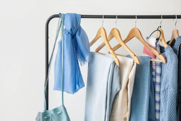 Rack Stylish Clothes Light Wall — Stock Photo, Image