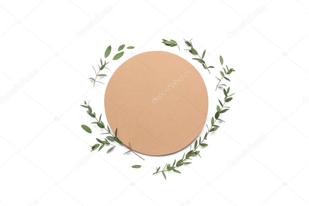 Blank card and eucalyptus branches on white background