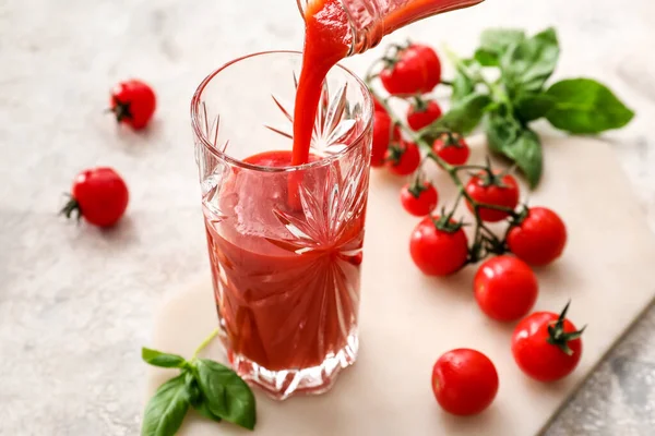 Pouring Tasty Tomato Juice Glass Light Background — Stock Photo, Image