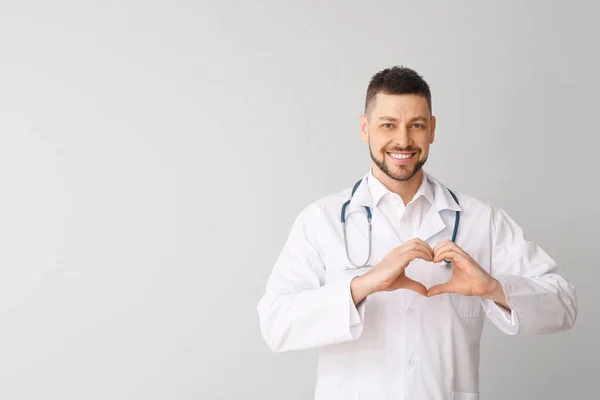 Cardiologist Making Heart His Hands Light Background — Stock Photo, Image