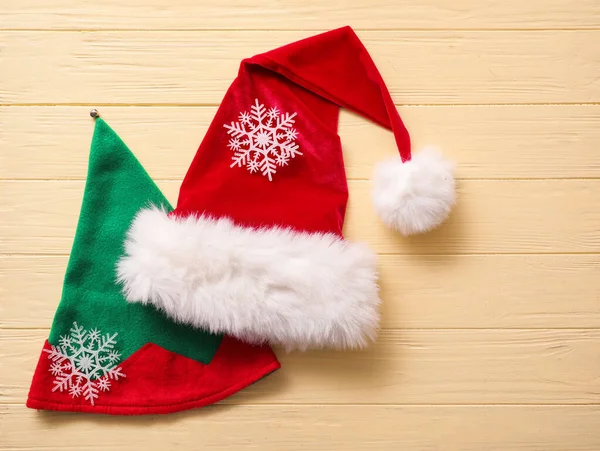 Santa Claus Elf Hats Color Wooden Background — Stock Photo, Image