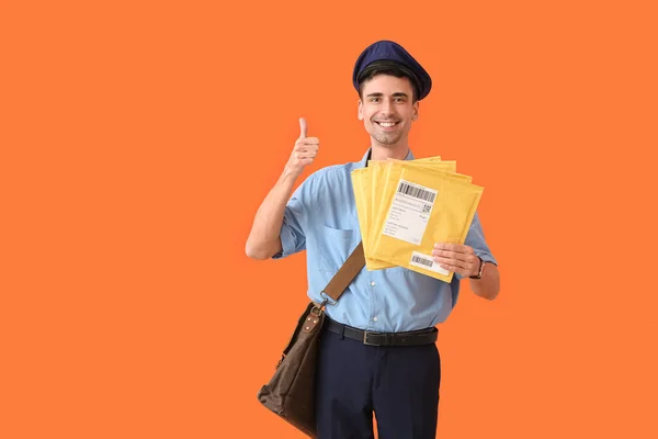 Handsome Young Postman Letters Showing Thumb Color Background — Stock Photo, Image