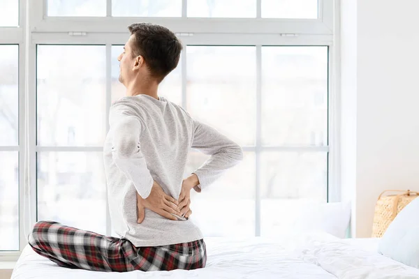 Young Man Suffering Back Pain Bedroom — Stock Photo, Image