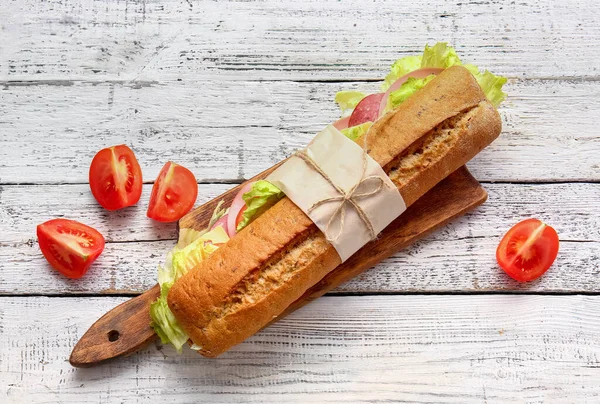 Board Tasty Ciabatta Sandwich Light Wooden Background — Stock Photo, Image