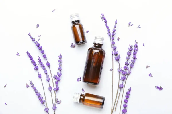 Bottles Lavender Essential Oil Flowers Light Background — Stock Photo, Image