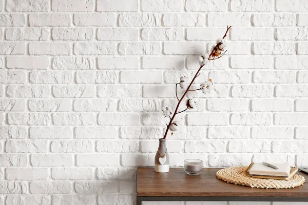 Vase Cotton Flowers Notebook Table Brick Wall — Stock Photo, Image