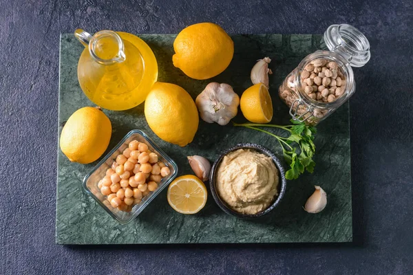 Composition Tasty Hummus Ingredients Dark Background — Stock Photo, Image