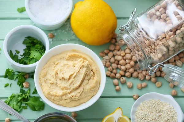 Bowl Tasty Hummus Ingredients Color Wooden Background — Stock Photo, Image