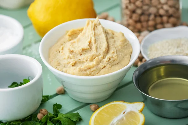 Bowl Tasty Hummus Ingredients Color Wooden Background — Stock Photo, Image