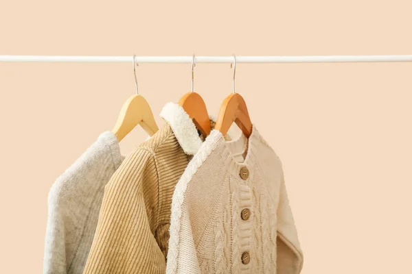 Stylish Baby Clothes Hanging Rack Color Background — Stock Photo, Image