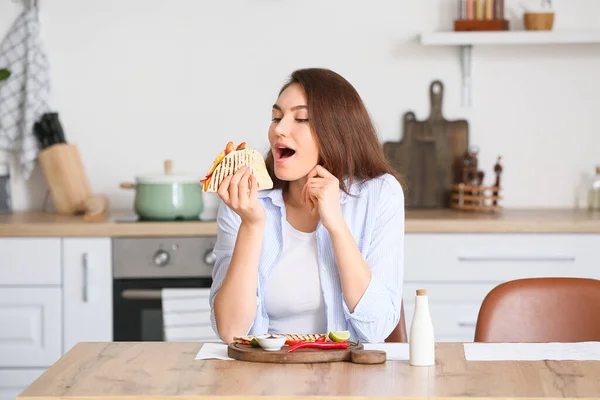 Beautiful Young Woman Eating Tasty Quesadilla Home — Stock Photo, Image