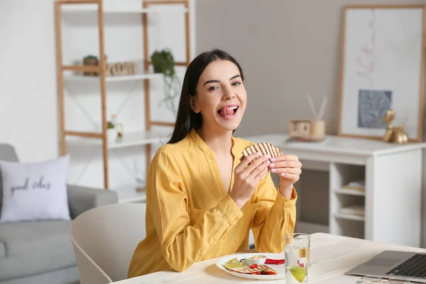 Beautiful Young Woman Eating Tasty Quesadilla Home — Stock Photo, Image