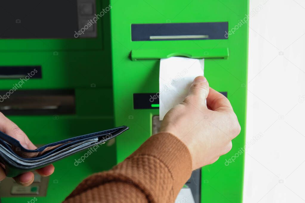 Man using modern ATM, closeup