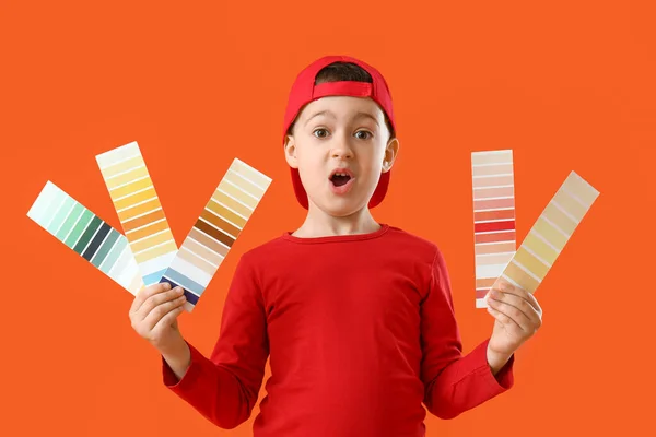 Shocked Little Boy Paint Samples Color Background — Stock Photo, Image