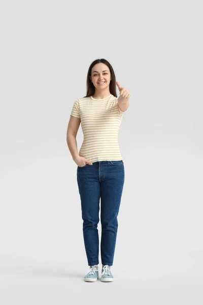 Beautiful Young Woman Showing Thumb Grey Background — Stock Photo, Image