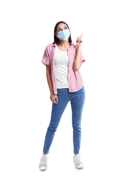 Young Woman Medical Mask Showing Something White Background — Stock Photo, Image