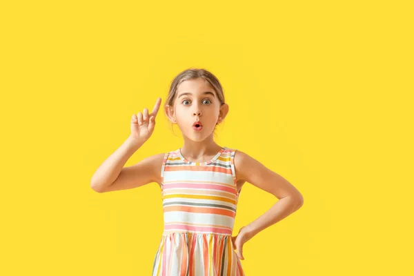 Emotional Little Girl Raised Index Finger Color Background — Stock Photo, Image