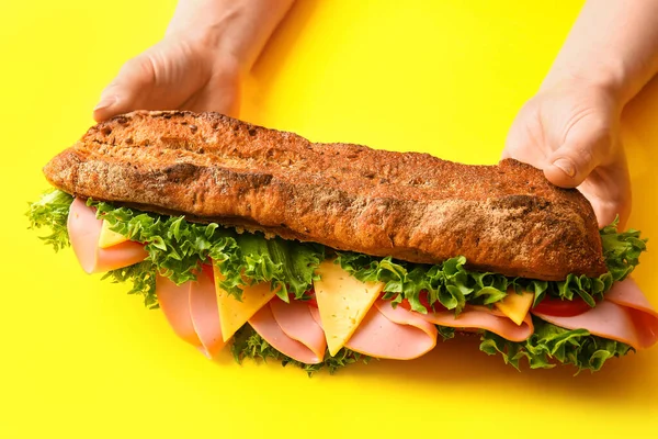 Female Hands Tasty Ciabatta Sandwich Color Background — Stock Photo, Image