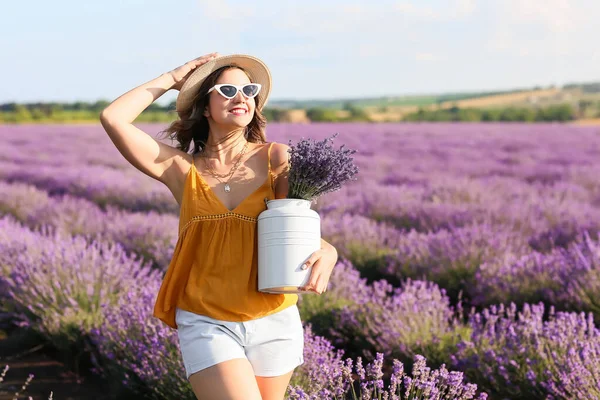 Beautiful young woman in lavender field