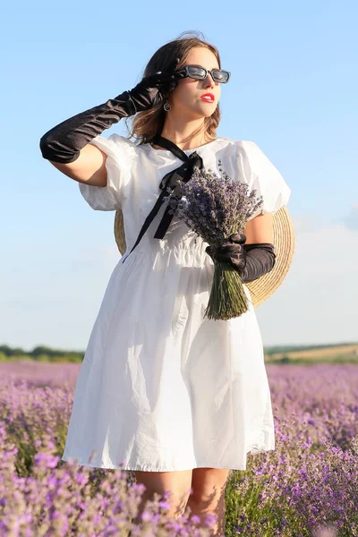 Beautiful young woman in lavender field