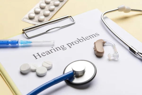 Clipboard Text Hearing Problems Pills Color Background — Stock Photo, Image