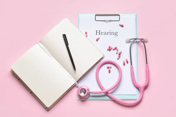 Clipboard Word Hearing Stethoscope Pills Color Background — Stock Photo, Image