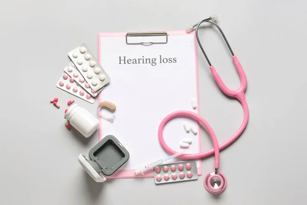 Clipboard Text Hearing Loss Stethoscope Pills Light Background — Stock Photo, Image