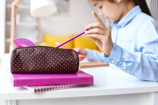 Little Girl Taking Pencil Case While Doing Homework Table — Stock Photo, Image